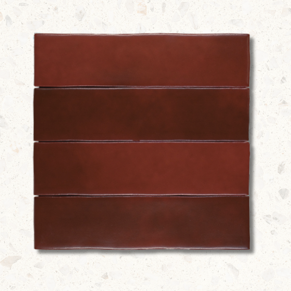Four red rectangular tiles on a textured white background