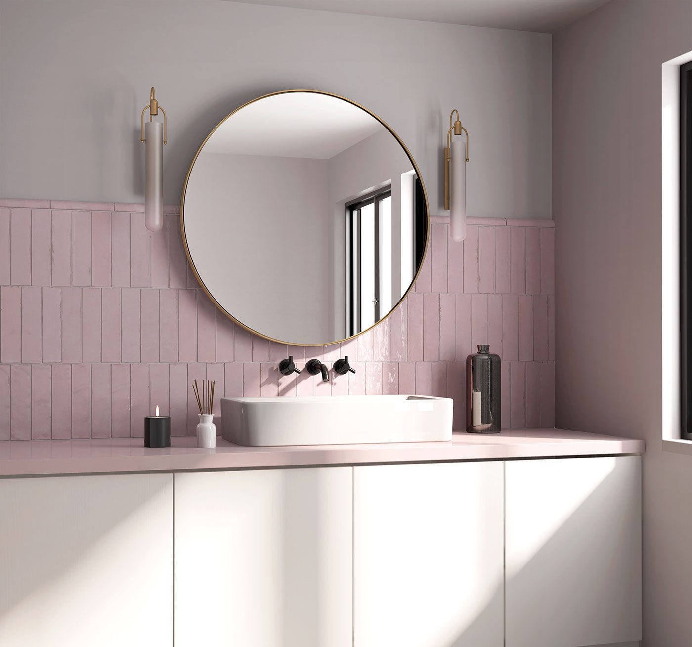Modern bathroom with round mirror, pink tiles, and white vanity.