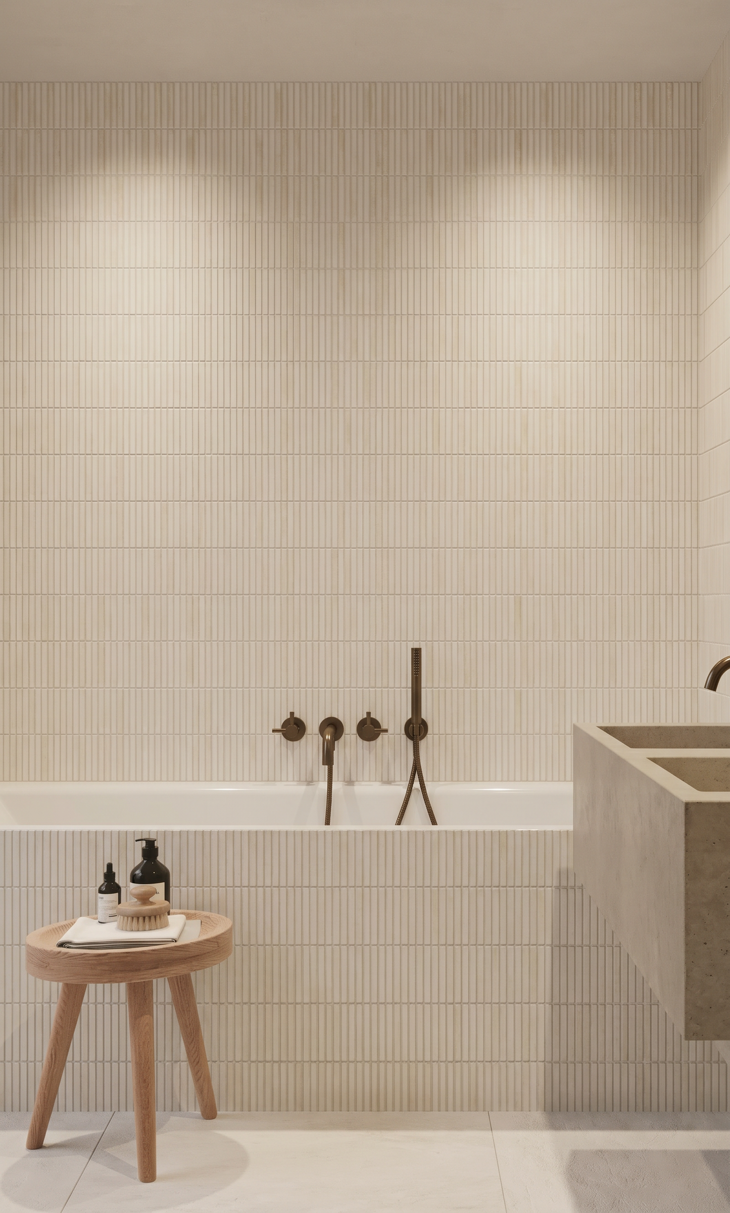 Modern bathroom with tiled walls, a wooden stool, and a bathtub.